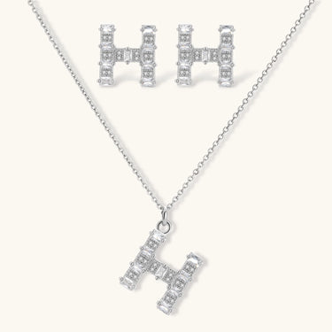 Letter H jewelry set featuring geometric crystal design in gold and white gold plated finish with adjustable chain necklace