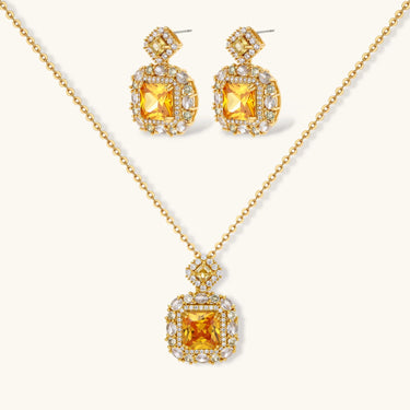 14K gold-plated jewelry set featuring square-cut cubic zirconia stones in ornate layered settings on white background.
