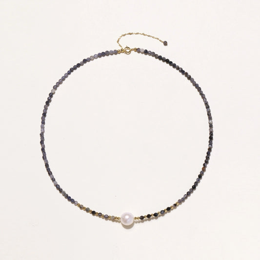 Dainty necklace with faceted purple iolite beads, gold vermeil accents, and central pink-white freshwater pearl.