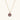 Gold-plated circular pendant with hand-painted purple enamel floral design on delicate chain against cream background