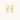 Gold-plated huggie hoop earrings with CZ-studded open circle charms on beige background