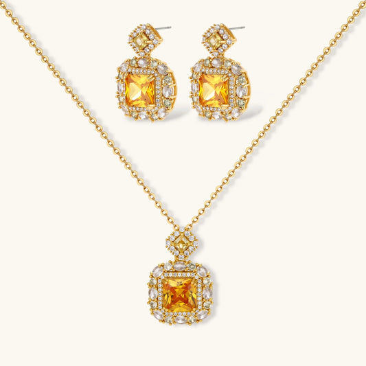14K gold-plated jewelry set featuring square-cut cubic zirconia stones in ornate layered settings on white background.