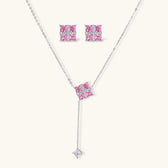 White gold plated jewelry set with pink cubic zirconia stones in geometric cross design, featuring Y-necklace and square stud earrings