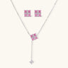 White gold plated jewelry set with pink cubic zirconia stones in geometric cross design, featuring Y-necklace and square stud earrings