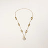 14K gold plated necklace with organic leaf motifs and freshwater pearls arranged in an elegant chain design on neutral background.