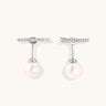 Rhodium-plated sterling silver ear jacket earrings with diamond-set horizontal bar and freshwater pearl drop