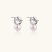 White gold stud earrings with square crystal stones in twisted frames and pink freshwater pearl drops below
