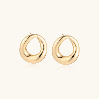 Pair of polished 18K gold-plated stainless steel teardrop earrings with hollow centers on cream background