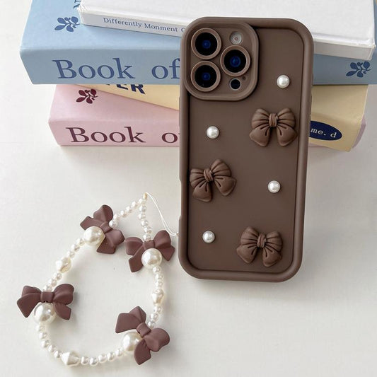 Soft Silicone 3D Bowknot Pearl Phone Case with Beaded Wrist Strap, For iPhone 15 Pro, For iPhone 15, For iPhone 14, For iPhone 14 Pro, For iPhone 14 Pro Max