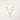 14K gold plated necklace with organic leaf motifs and freshwater pearls arranged in an elegant chain design on neutral background.